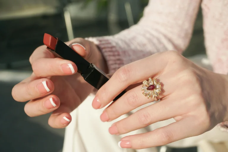 Close-up of fingernails with white spots being treated with natural remedies