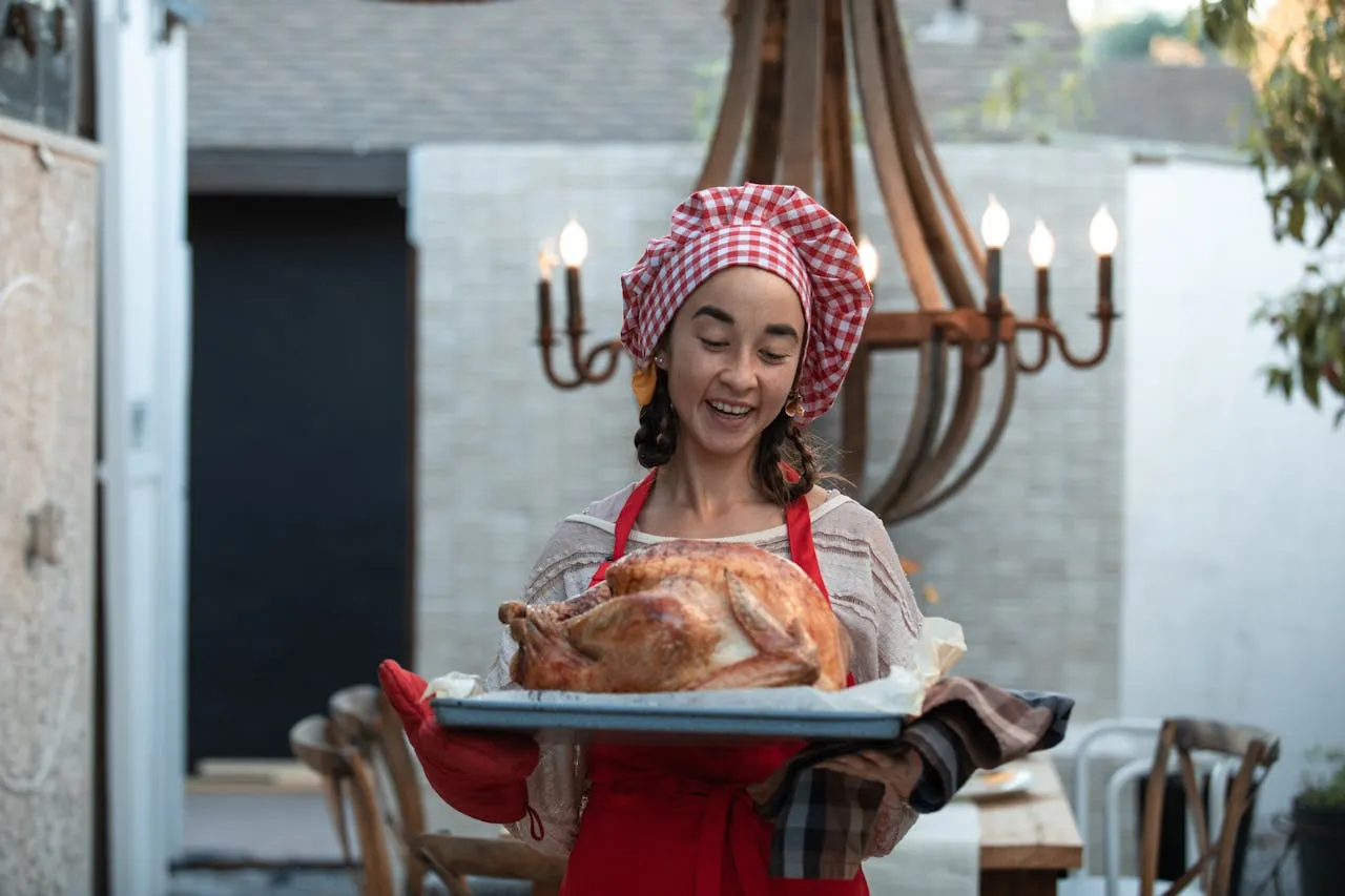 Close-up of a turkey with a pop-up timer, highlighting why pop-up turkey timers are unreliable for cooking safety.