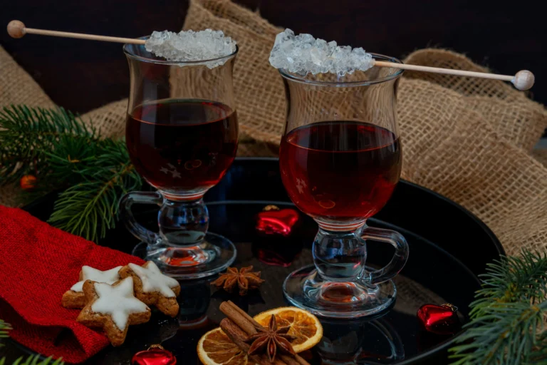 Sparkling raspberry-hibiscus mocktail in a copper mug with fresh berries