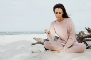 German woman practicing outdoor mindfulness exercises for natural anxiety relief