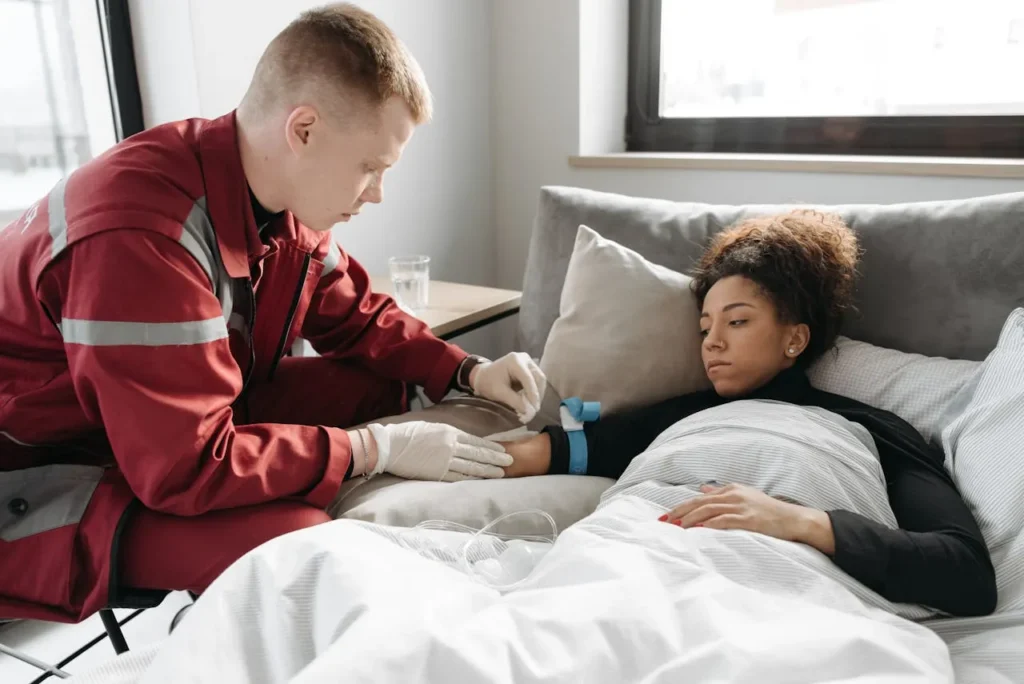 Emergency first aid for electric shock—rescuer performing safety steps to save a victim.